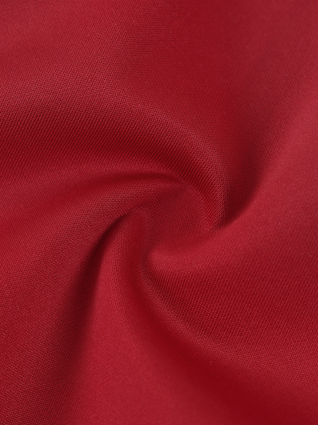 Close-up of red fabric with a textured surface