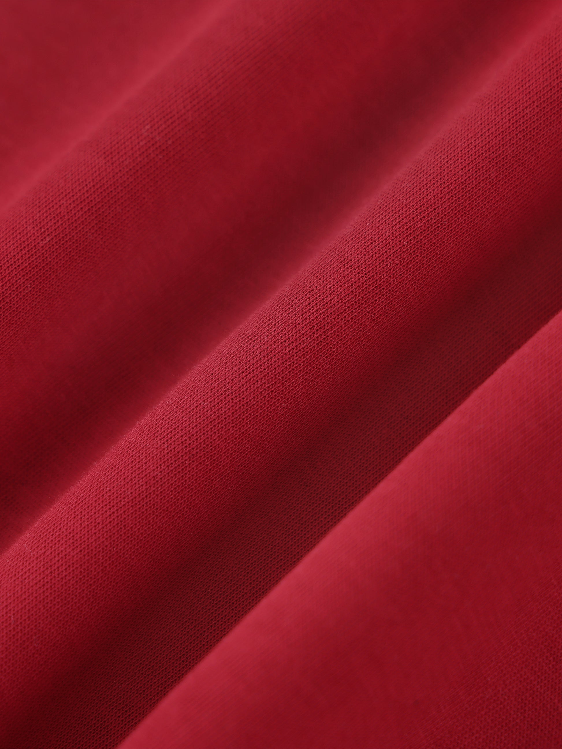 Close-up of red fabric with a textured pattern