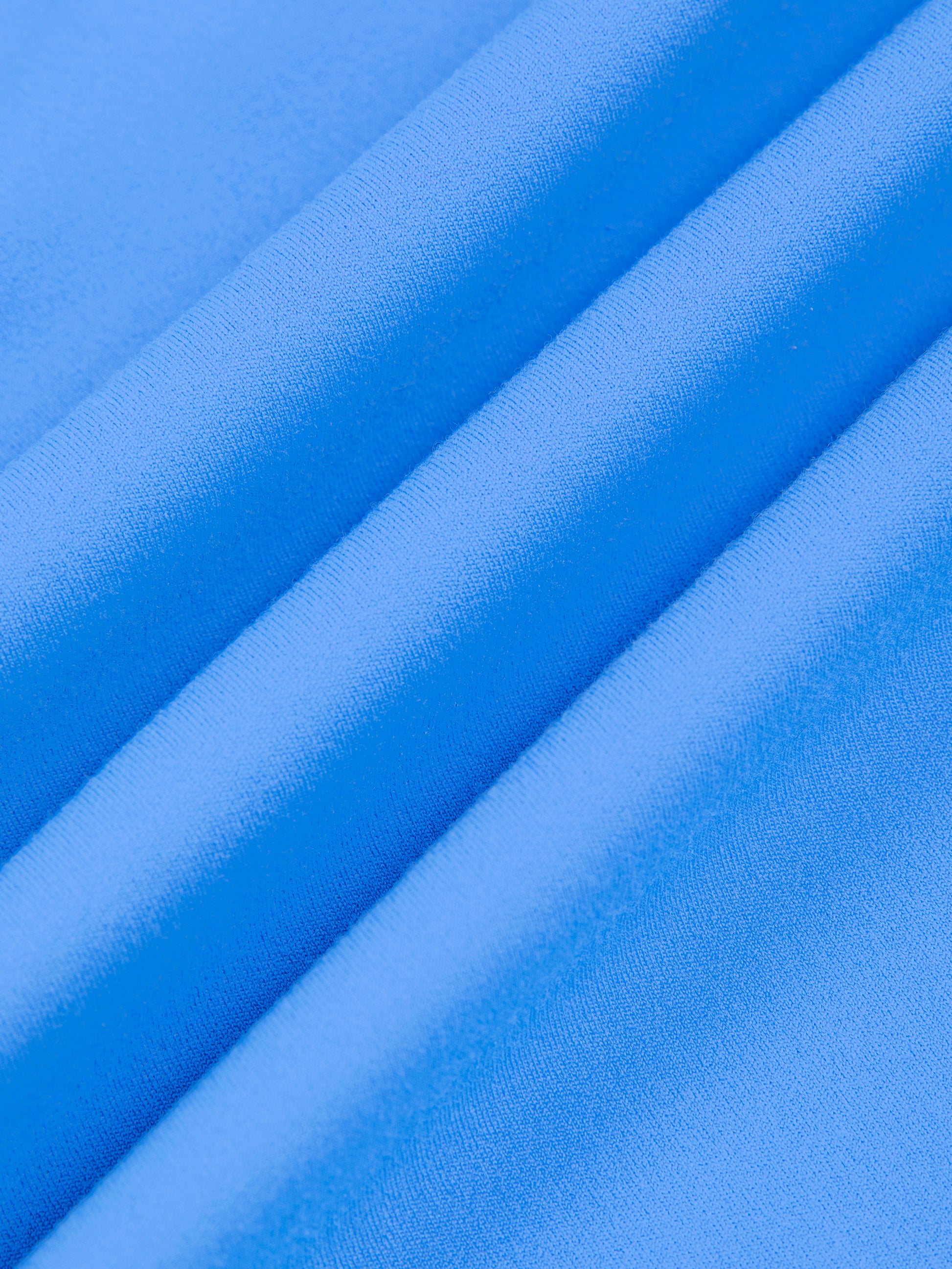 Close-up of blue fabric with folds