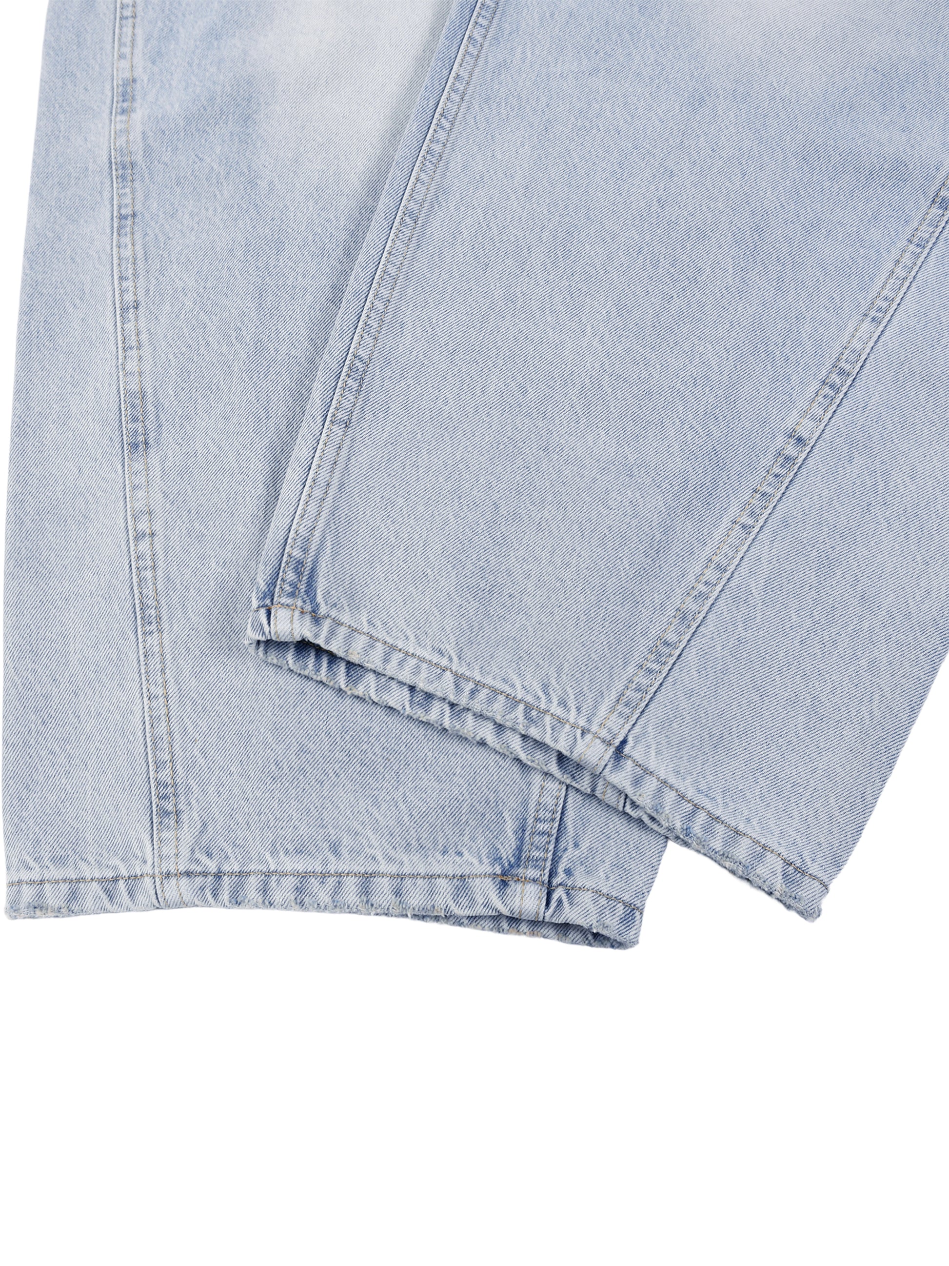 Light blue denim fabric with a subtle pattern on a white background
