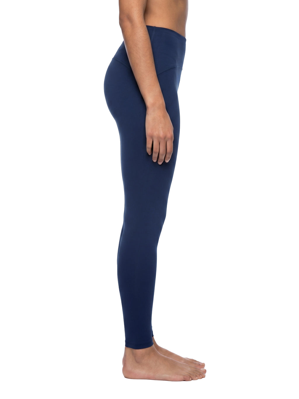 Navy blue leggings worn by a person on a white background