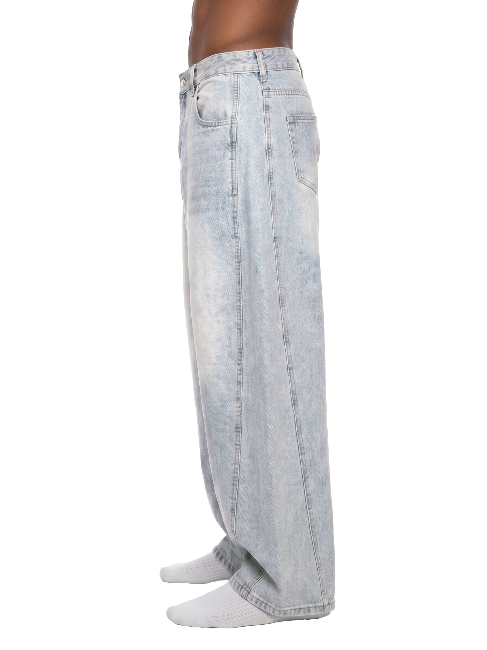 Light blue jeans worn by a person on a white background