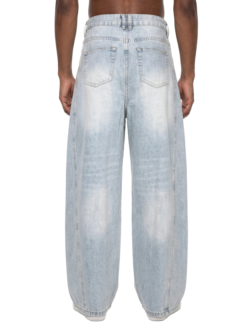 Light blue distressed jeans worn by a person on a white background