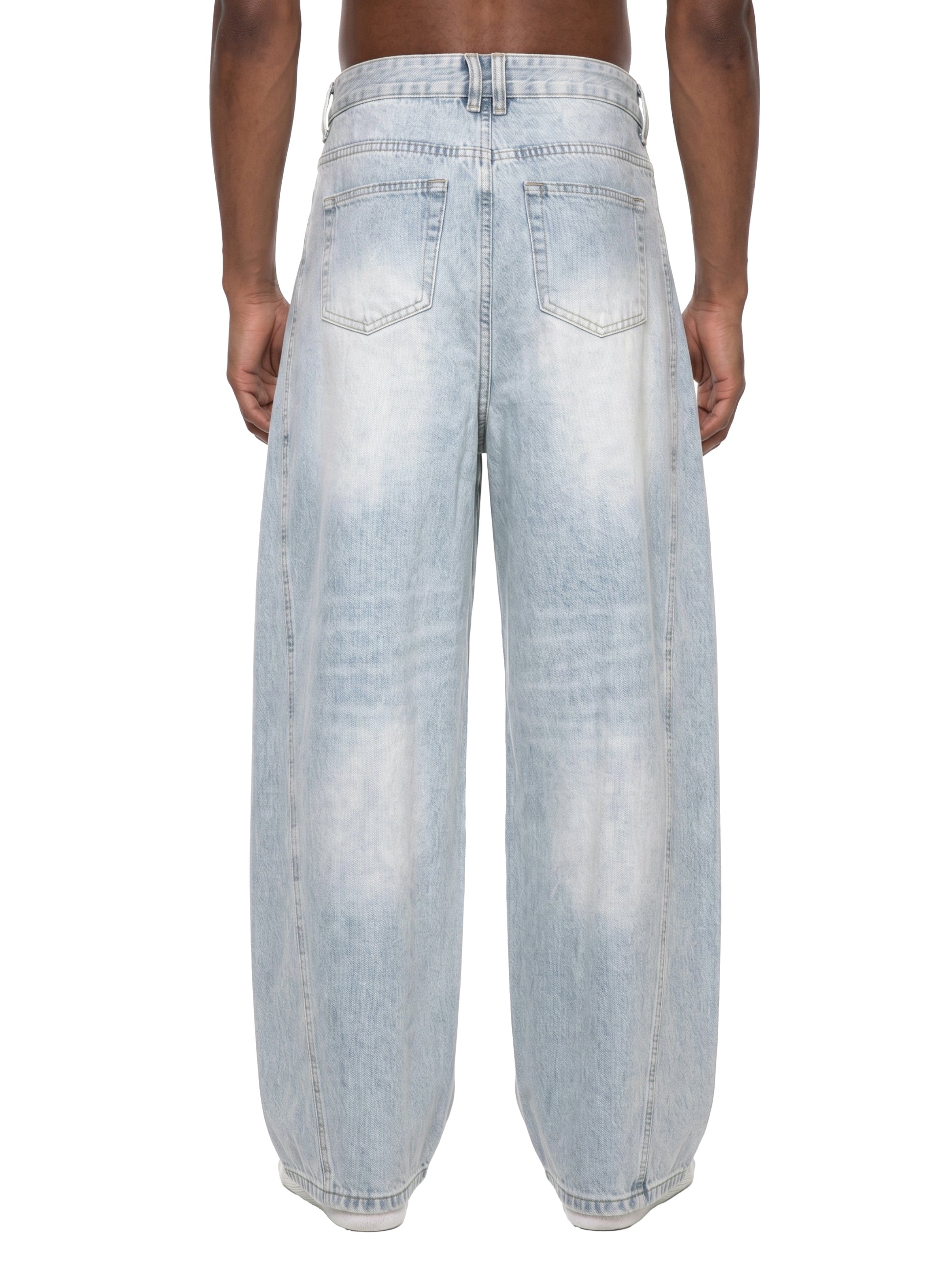 Light blue distressed jeans worn by a person on a white background
