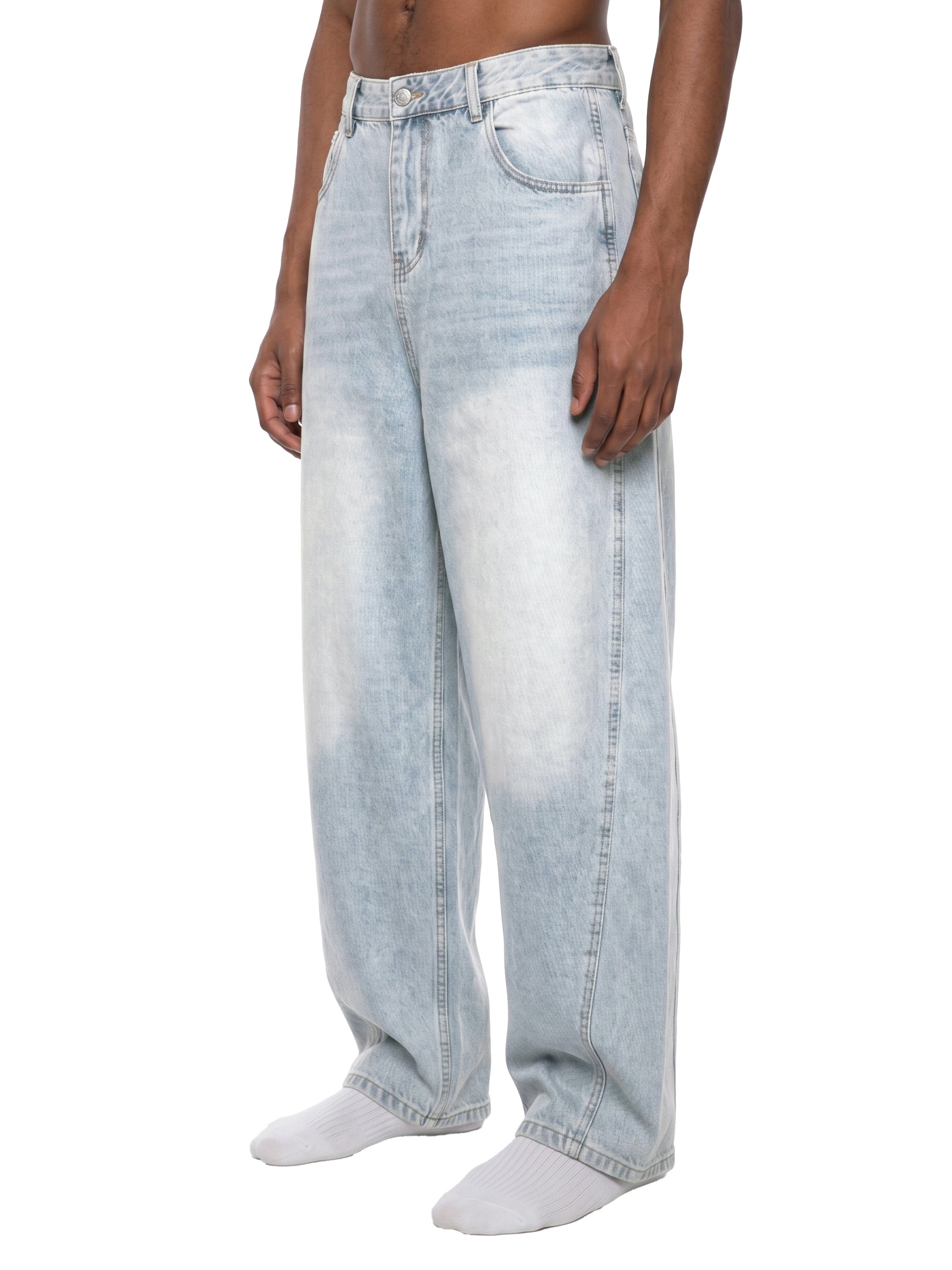 Light blue jeans worn by a person on a white background