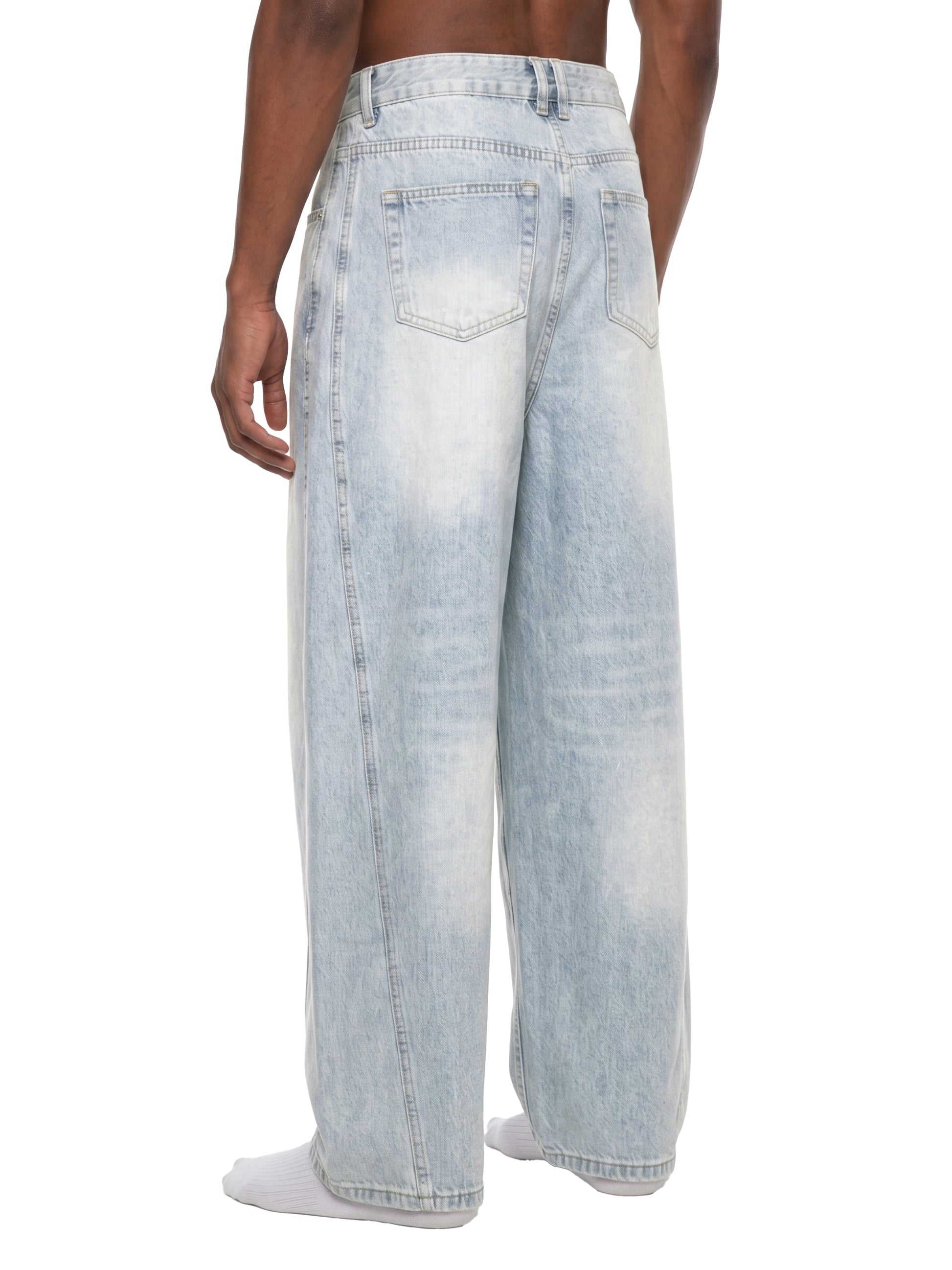 Light blue jeans worn by a person on a white background