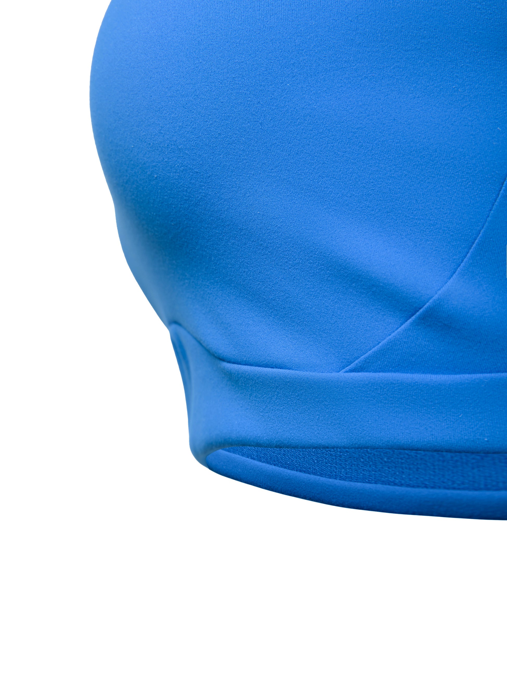 Close-up of a blue swimsuit top on a white background