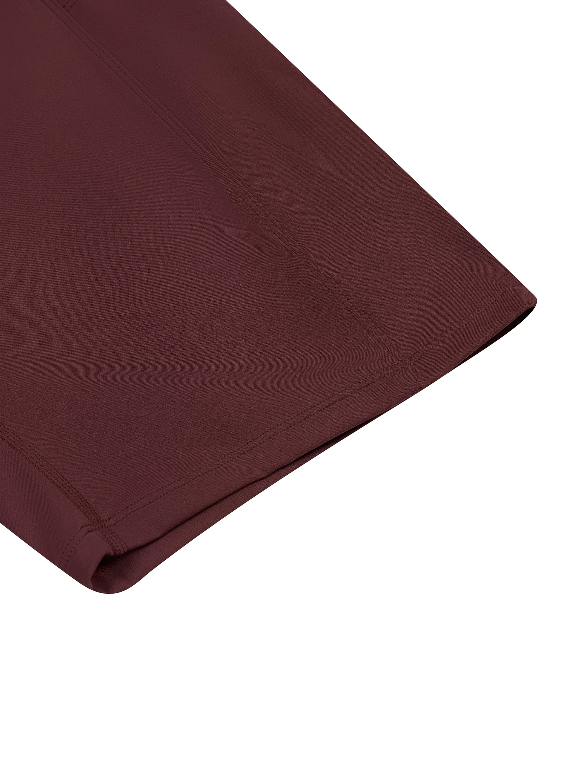 Folded maroon fabric on a white background
