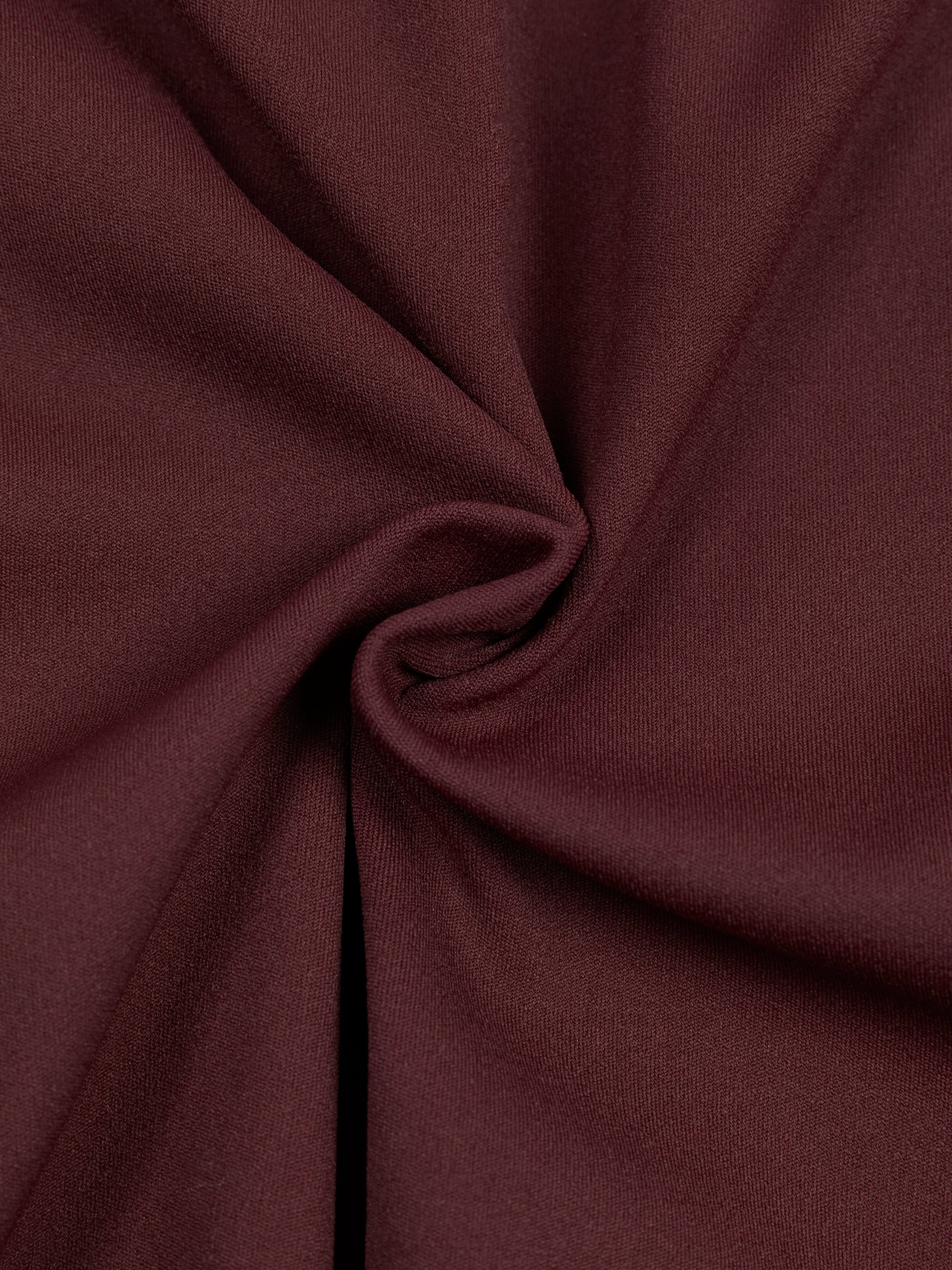 Close-up of brown fabric with folds