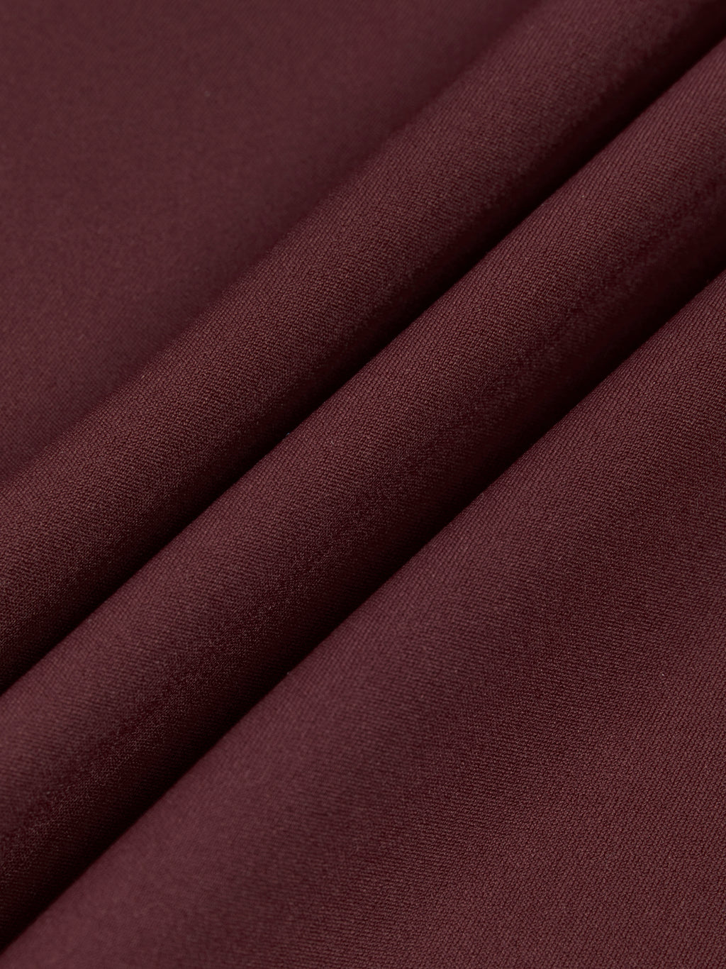 Close-up of dark brown fabric with a smooth texture