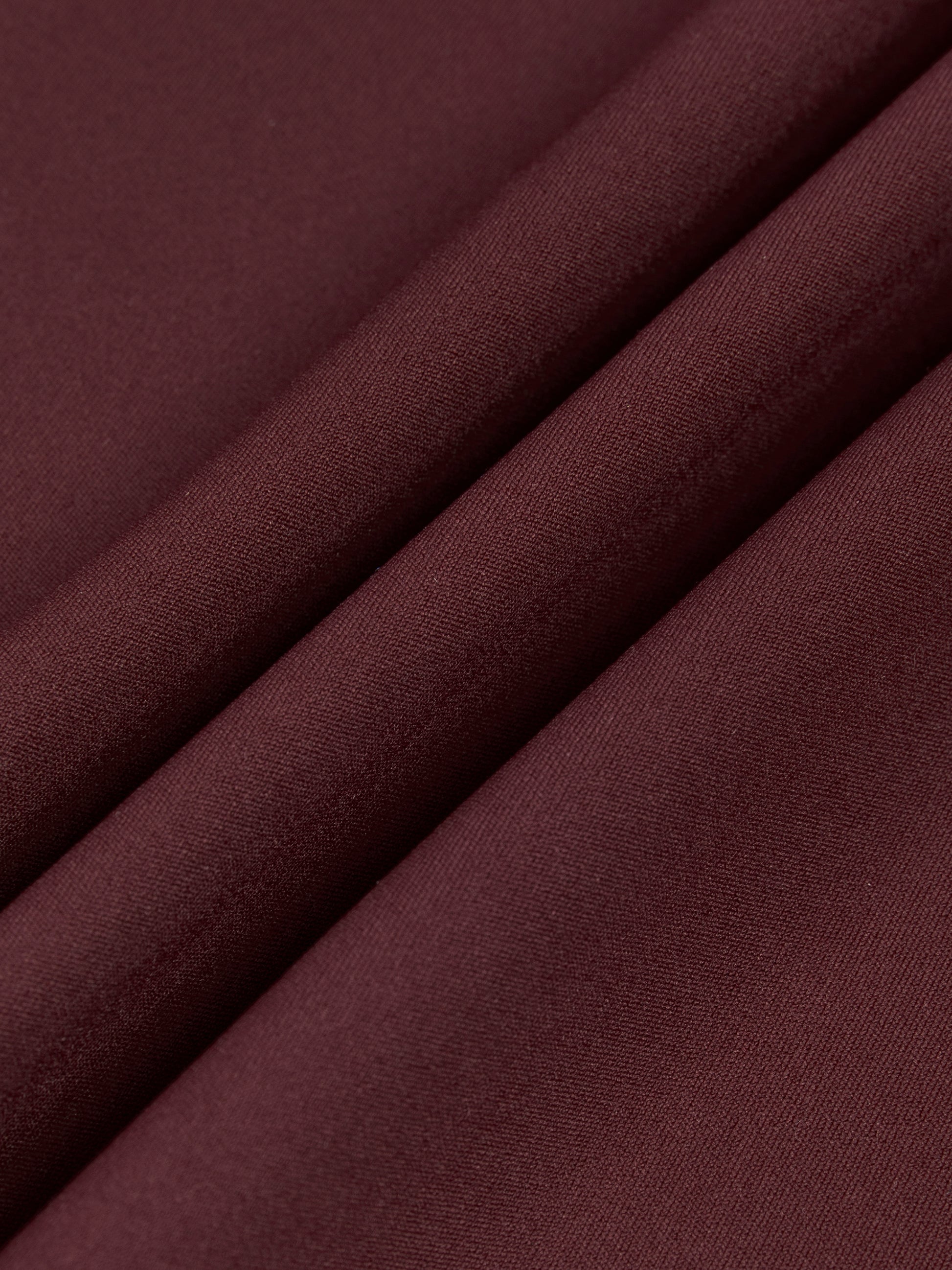 Close-up of dark brown fabric with a smooth texture
